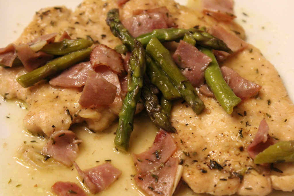 Chicken scaloppine with asparagus and ham.