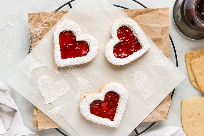 Heart shaped Linzer cookies with raspberry jam.
