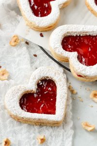 Heart shaped cookies with raspberry jam