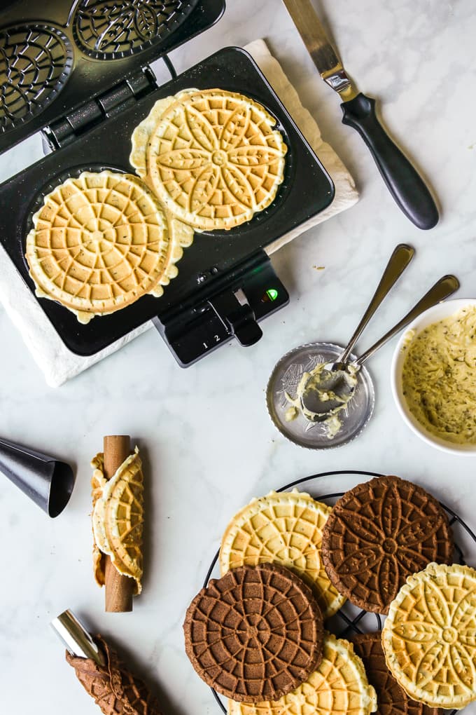 Using an electric pizzelle maker to make Italian pizzelle cookies.