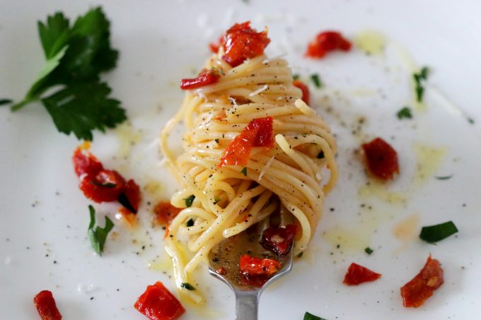 A forkful of spaghetti twirled around a fork.