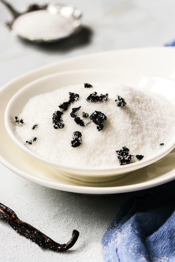 SMall white bowls filled with vanilla sugar.