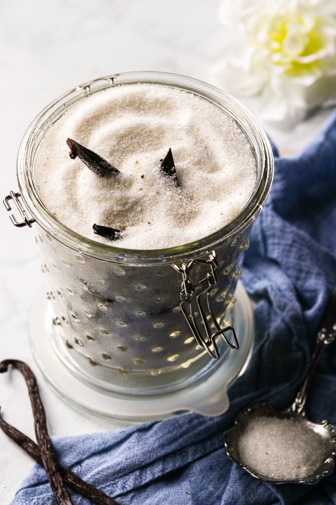 A glass jar filled with aromatic vanilla sugar.