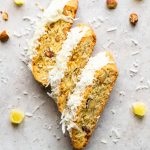 Three almond biscotti with pineapple, coconut and topped with melted white chocolate.