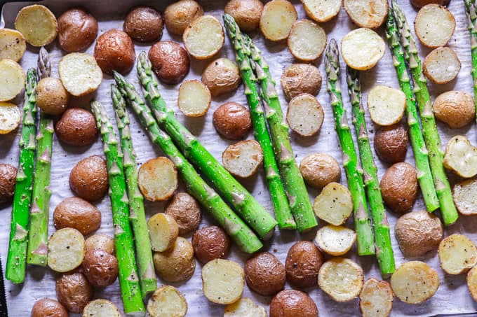 Chopped baby potatoes with asparagus topped with parmesan cheese.