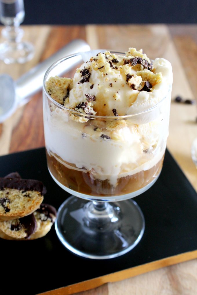 Drowned vanilla ice cream in a glass and topped with crumbles biscotti.