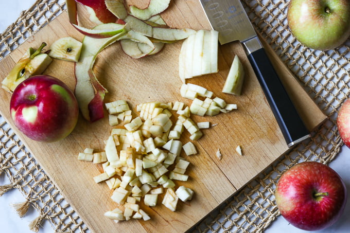 Diced apples on a cutting board.