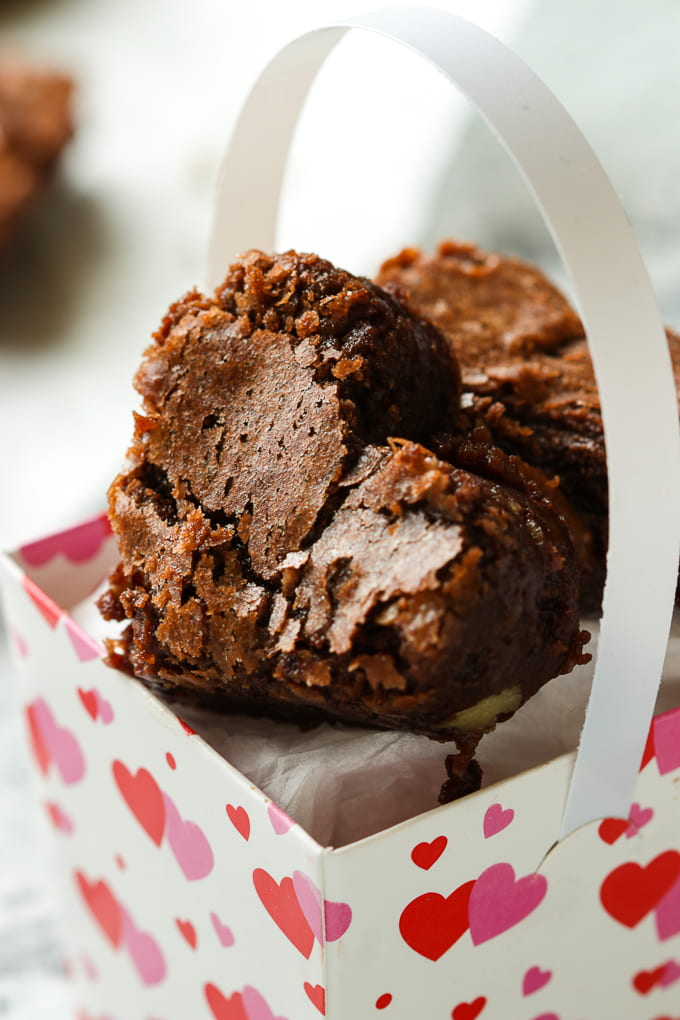 Mini brownies in a Valentine's paper basket.