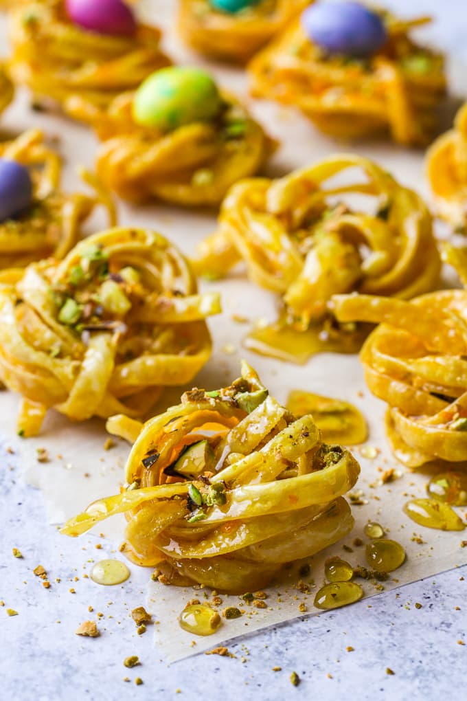 Deep fried fettuccine pasta nests soaked in warm honey and sprinkled with crushed pistachios.