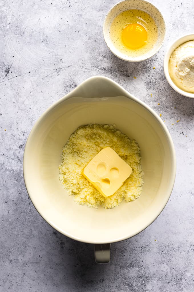 Lemon sugar and softened butter in a white mixing bowl.