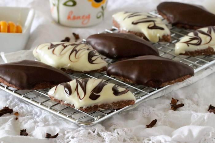 Mostaccioli cookies with honey on a silver cooling rack