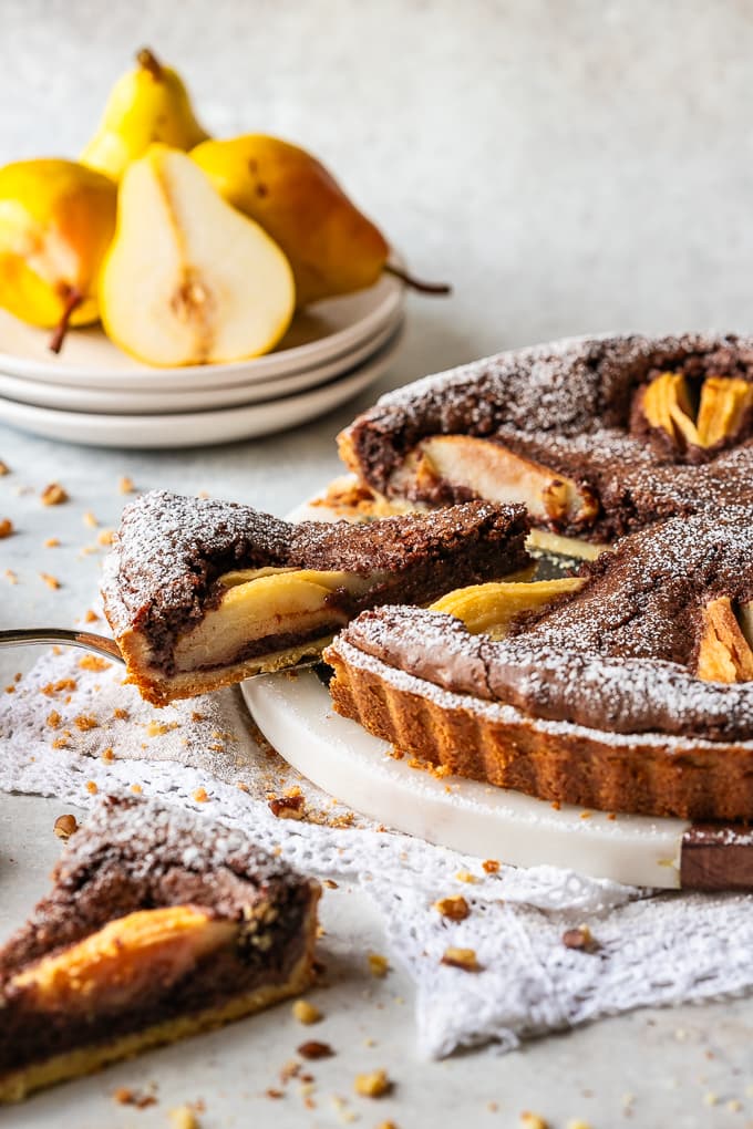 Chocolate and Pear Crostata with a slice cut off.