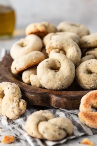 Italian wine cookies with anise on a wooden serving tray.