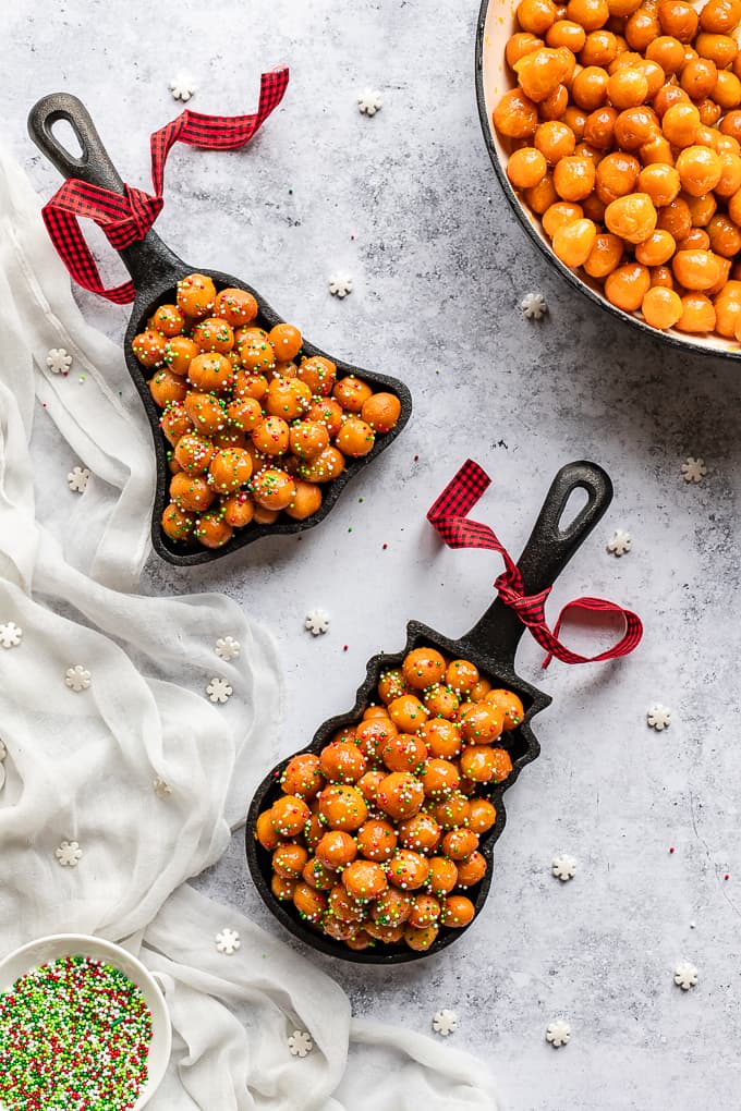 Italian honey balls called struffoli and served in a cast iron skillet.