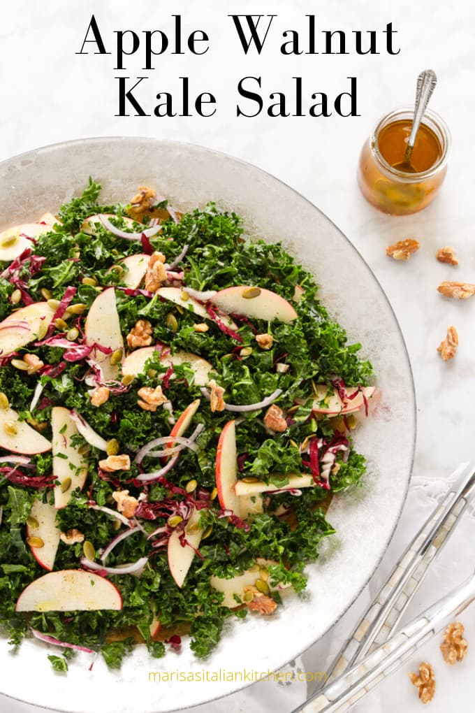 Kale salad with roasted walnuts and sliced apples.