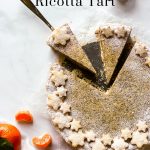 Ricotta tart dusted with powdered sugar.