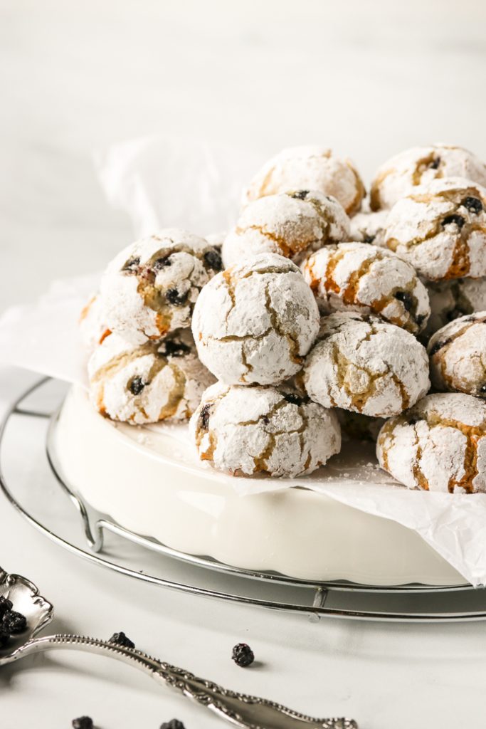 White tray piled high with amaretti cookies.