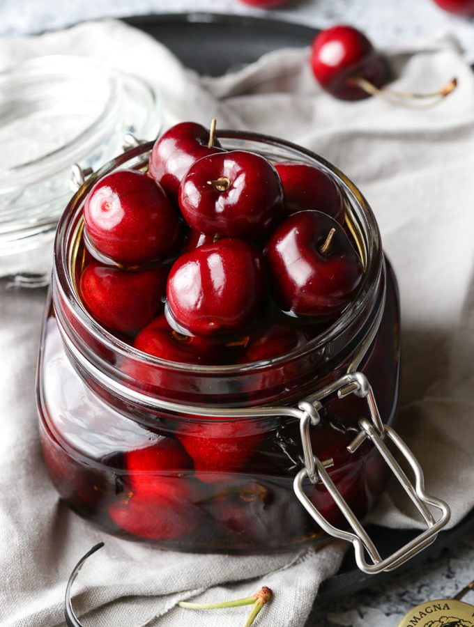 Cherries in a glass jar.