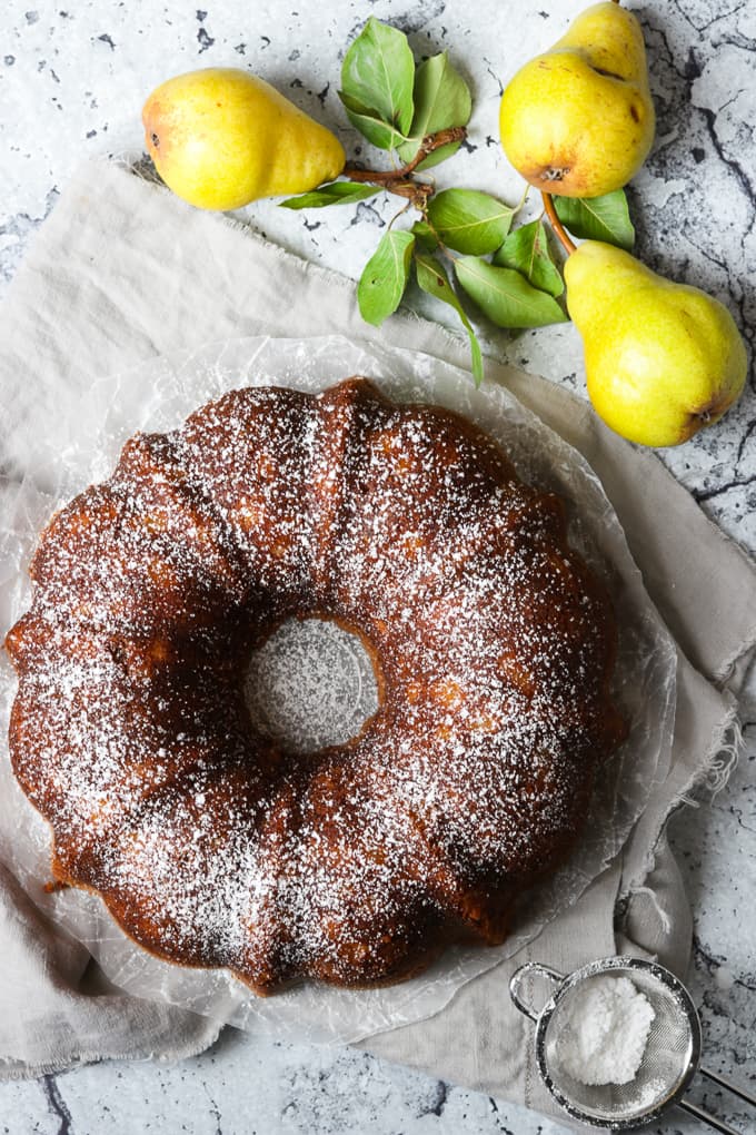 Pear cake dusted with powdered sugar.