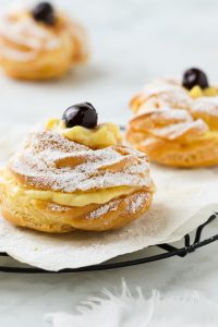 Oven baked Zeppole filled with custard.