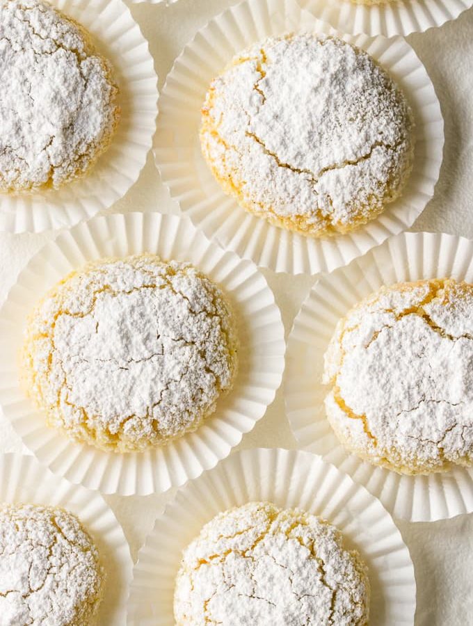 Ricciarelli cookies on white candy wrappers.