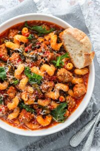 A plateful of Italian spicy sausage soup with Italian greens.